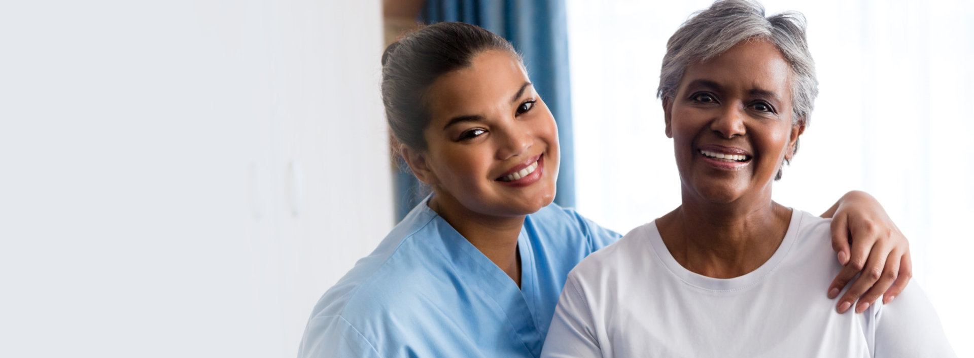 a picture of a caregiver and her patient smiling