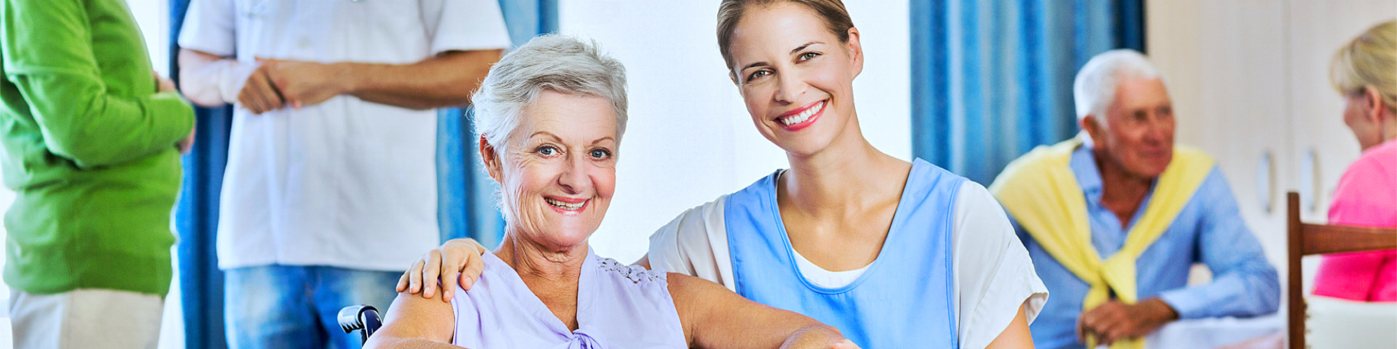 a portrait of a care giver and her patient smiling inside living room